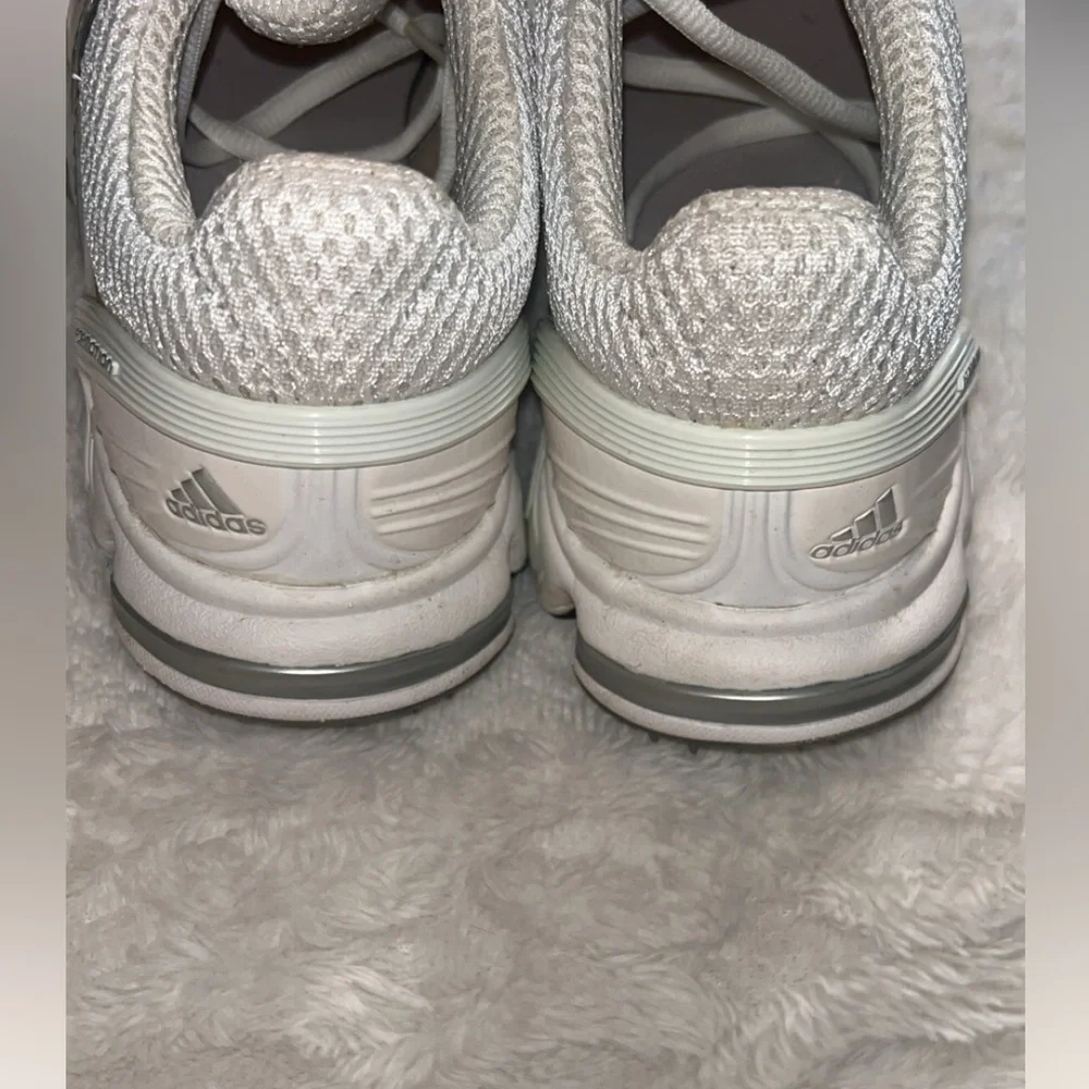 Adidas Traxion Lite S 50/50 Protect women's golf shoes.